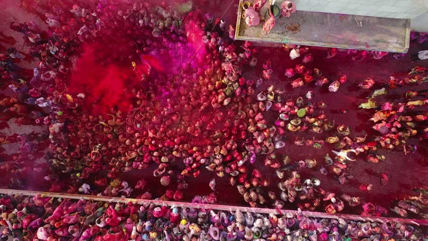 Color battle at the holi festival in India, 4k aerial shot Royalty-Free Stock Footage #30610999