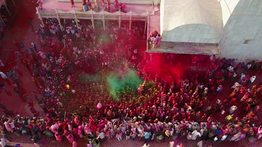 Color battle at the holi festival in India, 4k aerial shot Royalty-Free Stock Footage #30611017