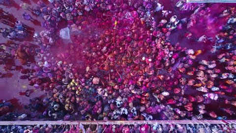 Color battle at the holi festival in India, 4k aerial shot