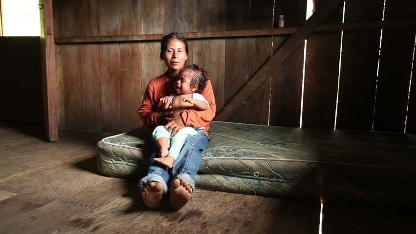 Mother and child living in very poor conditions, Ecuadorian Amazonia