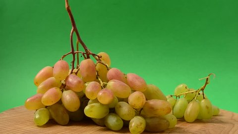 Grapes on a kitchen board.