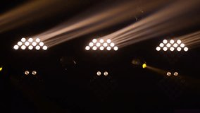 Bright stage lights flashing. 