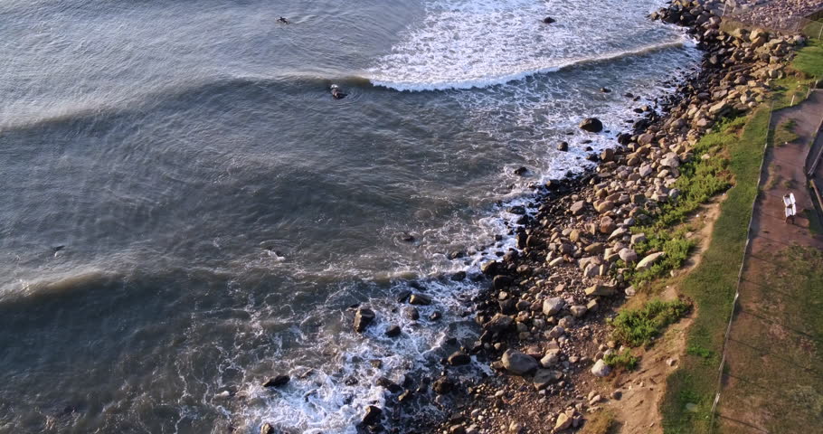 AERIAL: Surfer Riding Barrel 