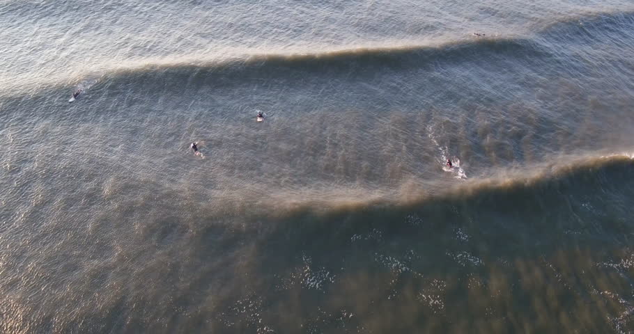 AERIAL: Surfers Catching Waves