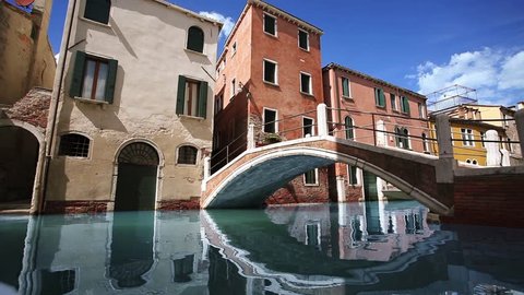 Moving reflexes in the water in Venice canal and reflexes on bridge. Cinemagraph. Looping video
