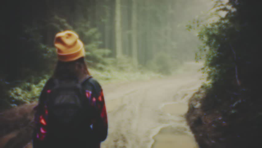 Youthful hipster teenagers walking in the mountain forest. VHS quality amateur home video. Traveling people lifestyle - trip vlog.