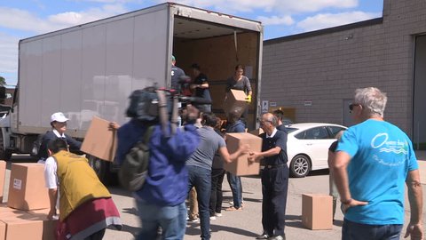 Toronto, Ontario, Canada September 2017 Workers in Toronto prepare emergency aid supplies for hurricane Irma survivors
