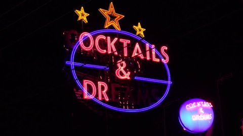 ZAKYNTHOS ISLAND - GREECE, 30 AUGUST, 2017, 4K Cocktails bar advertising sign blink by night, illuminated red led flashing
