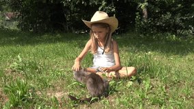 Child Playing Petting Cat on Grass, Girl with Animal Pet in Courtyard 4K