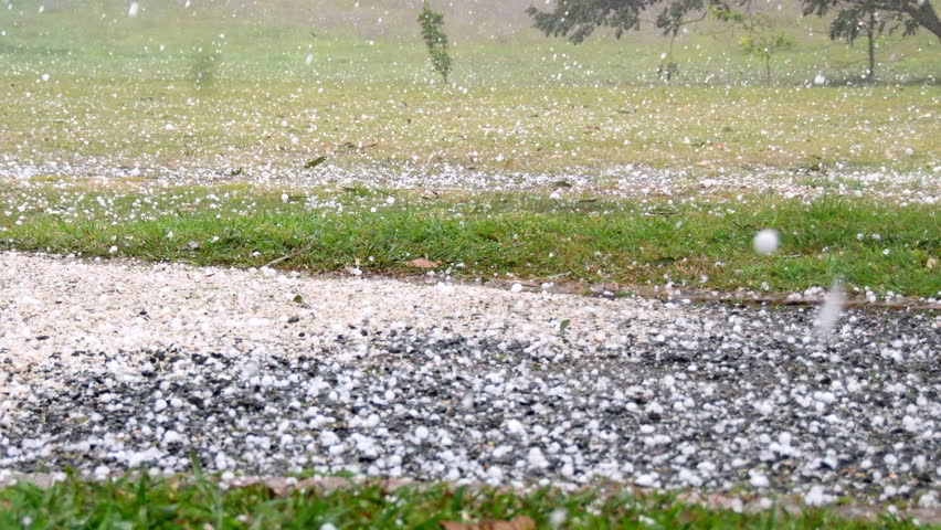 Heavy hail stones falling during violent storm on rural property