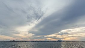 4K Time lapse of clouds movement over sea with passenger boat coming