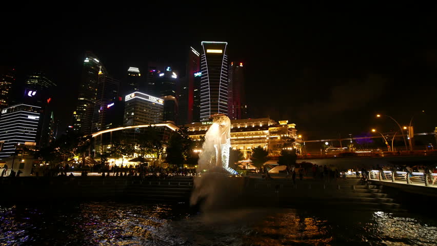SINGAPORE - 19 AUGUST 2017: 4k video of The Merlion fountain & Singapore skyline at night on 19 AUGUST 2017 in Singapore. 