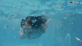 Girl diving in swimming pool. Super Slow Motion.
Perfect for videos about: swimming, pools, summer fun, vacation, getaways, underwater footage, kids, beating the heat, and exercise.