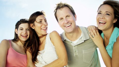 Portrait of healthy Caucasian male and females in colourful beach clothes in the sun on vacation RED EPIC: film stockowy