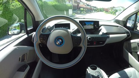 Ljubljana, Slovenia, 7th September 2017: CLOSE UP POV, Futuristic computer sensor robotic technology controlling futuristic self-driving self-steering automated autonomous electric car BMW i3.