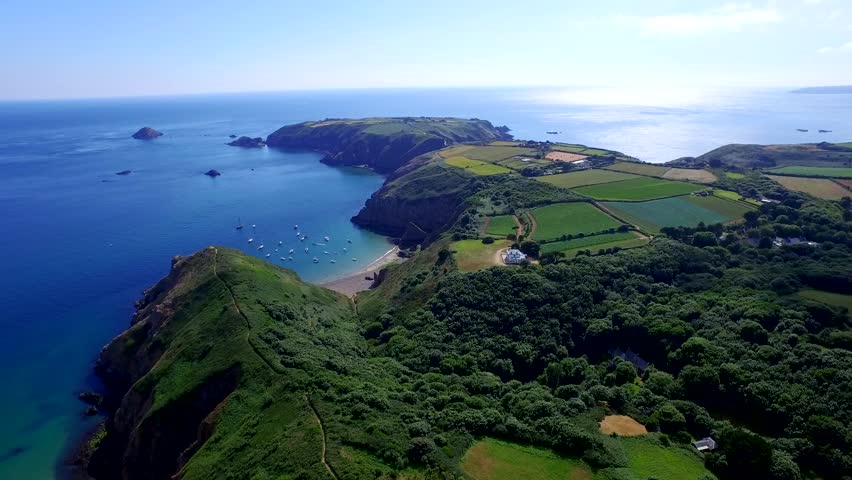 Flight above Sark island in the Channel Islands in the southwestern English Channel. Off the coast of Normandy, France, part of the Bailiwick of Guernsey. Royalty-Free Stock Footage #30686536