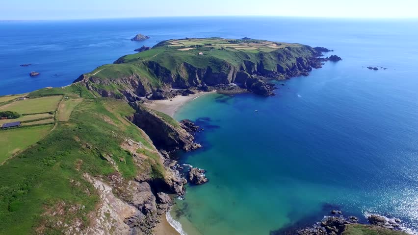 Flight above Sark island in the Channel Islands in the southwestern English Channel. Off the coast of Normandy, France, part of the Bailiwick of Guernsey. Royalty-Free Stock Footage #30686671