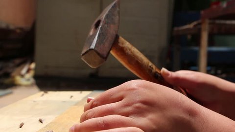 Failed attempt to hit a nail with a hammer on DIY course