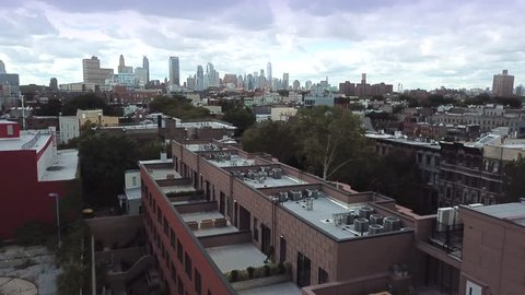Brooklyn, Clouds NYC AERIAL with Manhattan Skyline, 2017, Bedford-Stuyvesant area. Could be darkened for mood..