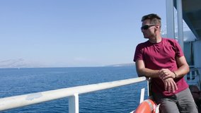 Adult man travels by ferry to the Adriatic Sea
