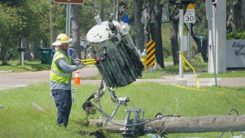 TAMPA, FL - SEPT 12: Utilities worker fixing downed power lines after Hurricane Irma damage, on September 12, 2017. Over 3.8 million homes and businesses in Florida lost electricity after the storm. 