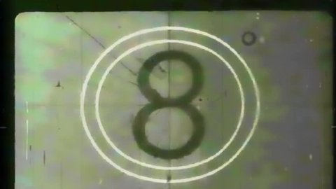 Montage of authentic film leader elements taken from old public domain films, followed by a SMPTE Universal Leader countdown, and ending with several seconds of dust and scratches. 