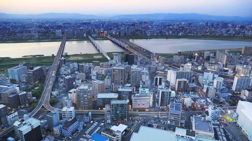 High-rise buildings in the middle of Osaka with spectacular sunset colors. Umeda district aerial view. Osaka cityscape,time lapse Japan.