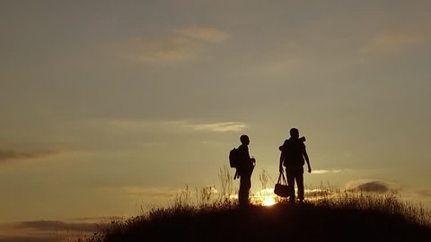 people tourists. people group of tourists walking on top of a travel sunset silhouette mountain. slow motion nature video tourists people group go