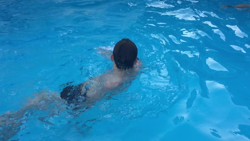 Bathe in the pool water. kids children boy and girl swimming in the pool playing slow motion video | Shutterstock HD Video #30728170