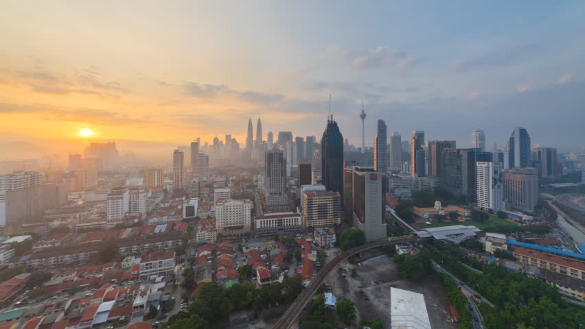 Time lapse: Beautiful and dramatic sunrise view of the Kuala Lumpur skyline overlooking the city, Tilt Up | Shutterstock HD Video #30729406