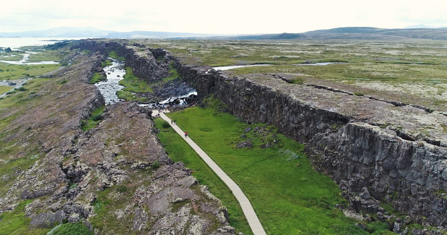 Oxararfoss waterfall in Pingvellir national park in Iceland. Water falling into the tectonic rift.
Rising above the waterfall.