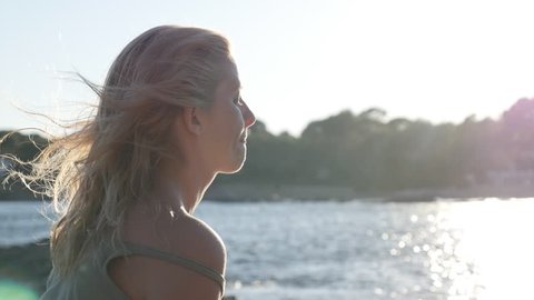 Daydreaming of blond female close-up 4K 2160p 30fps UltraHD footage - Caucasian woman enjoying nice weather before sunset 3840X2160 UHD video
