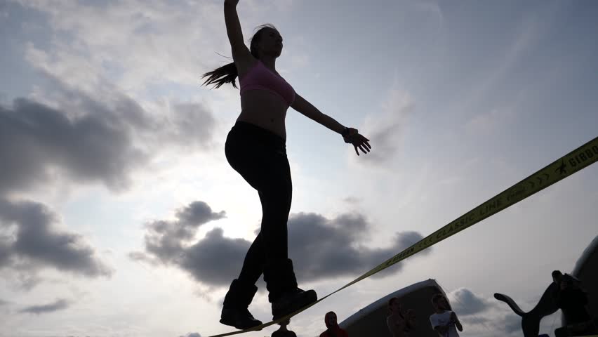 Young Girl Silhouette Walk On A Slackline Balancing Rope The Modern Sport Activity