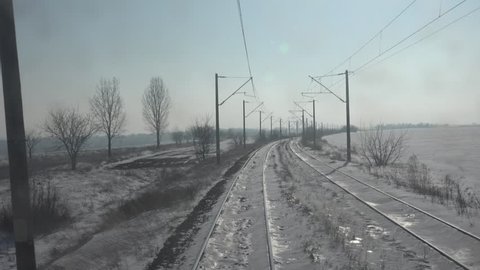 4K POV Point of view of train transportation in winter cold day, frozen railway rail