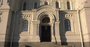 4K video footage view of beautiful Nikolskiy Navy cathedral, anchor square, area around it in the heart of Kronstadt town near St Petersburg 700 km from Moscow, Russia on sunny summer morning