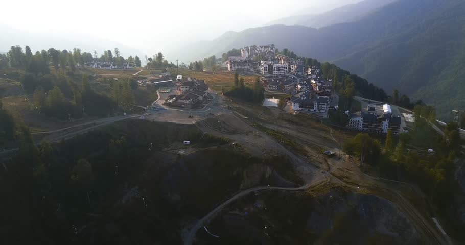 Flight over the mountainous Olympic village. The valley in the haze