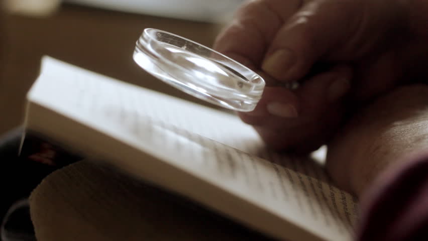 Reading with magnifying glass 2