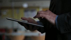 Tablet used by businessman, CLOSE-UP - Powered by Shutterstock - Get 15% off with code: PIKWIZARD15