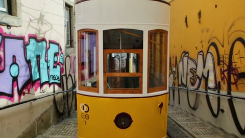 Lisbon, Portugal - August 26, 2017: Hyperlapse POV of Bica funicolar intersection. Ascensor da Bica is Lisbon most picturesque funicular, leading up to Bairro Alto with scenic views of Tagus River.