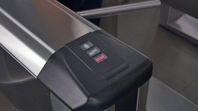Hands of people apply electronic pass to turnstile wicket checkpoint in office. Modern equipment of access system in business center closeup. Macro video. Successful employees are not late.