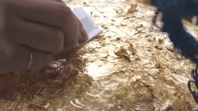 Close up hand women is gilding,Belief in Buddhism. - Powered by Shutterstock - Get 15% off with code: PIKWIZARD15
