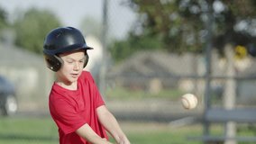 Young boy hits a homerun during a baseball game. - Powered by Shutterstock - Get 15% off with code: PIKWIZARD15