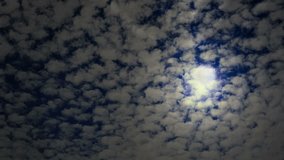Moonlit night with fleecy clouds passes on dark blue sky, timelapse video - Powered by Shutterstock - Get 15% off with code: PIKWIZARD15