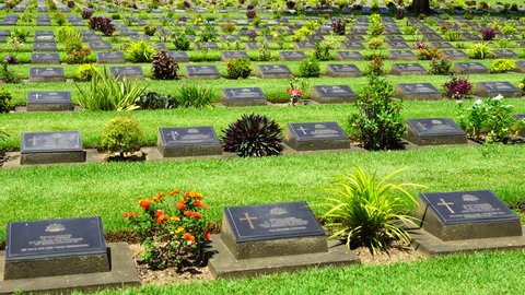 Pan angle, The cemetery contains the remains of 6,982 Allied prisoners of war the Second World War in the Kwai River Bridge at Kanchanaburi Allied War Cemetery, Thailand.