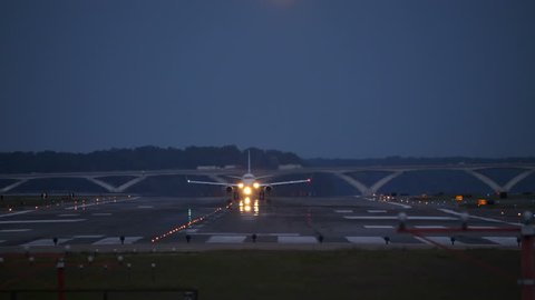 Washington DC September 2017 : Airplane Taking off Reagan National Airport at Dusk Bright Lights