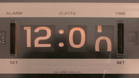 stop motion of an old style flip clock running through 12 hours