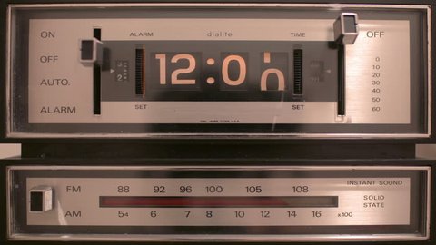 stop motion of an old style flip clock running through 12 hours