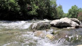 Quick small river (Megalopotamos) in Crete, Greece in pure nature