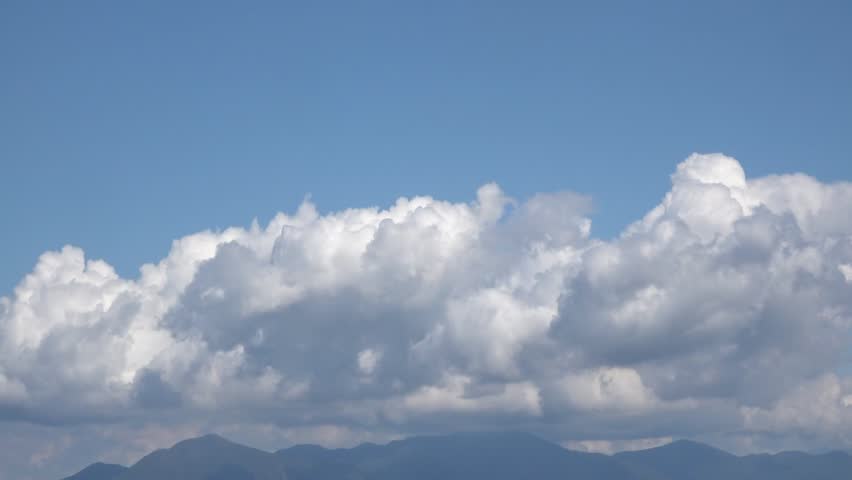 cumulus clouds over the mountains

