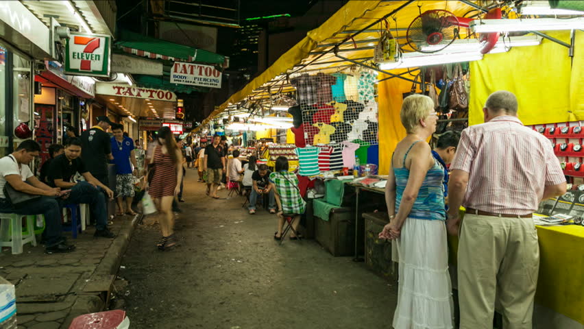 BANGKOK - NOVEMBER 29: Time lapse view of tourists shopping in Patpong Silom